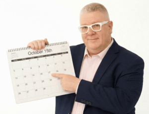 Brian pointing holding and pointing to a calendar to represent Bookkeeping clean up in 30 days.